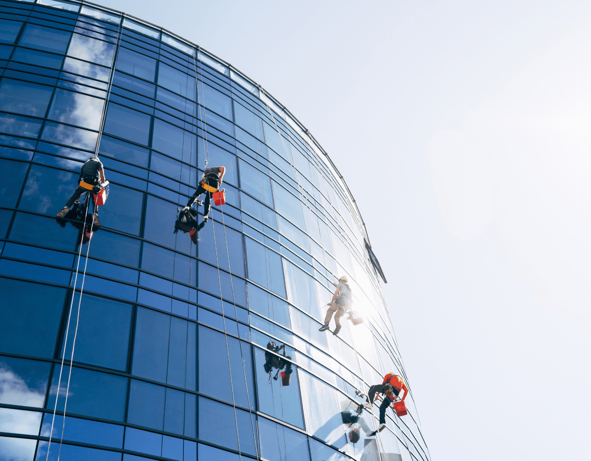 Professional cleaner sanitising a modern office in Canberra